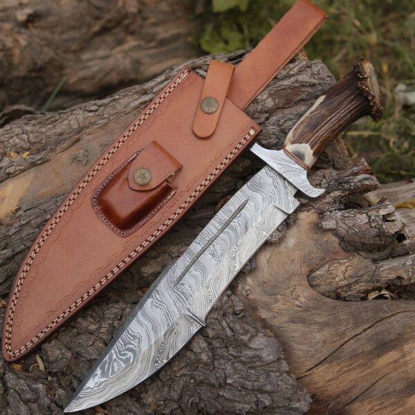 "Close-up of a meticulously crafted Damascus Bowie knife, showcasing its exquisite patterned blade and elegant handle."