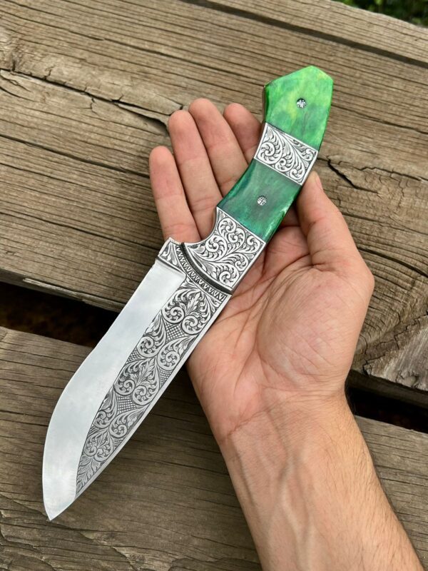 Custom hand-engraved hunting knife featuring a stainless steel blade and a beautifully crafted wooden handle with intricate engraving. This high-quality knife is perfect for hunting and outdoor activities and makes for a unique and stylish addition to any collection."