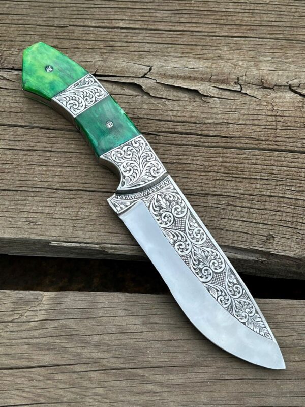 Custom hand-engraved hunting knife featuring a stainless steel blade and a beautifully crafted wooden handle with intricate engraving. This high-quality knife is perfect for hunting and outdoor activities and makes for a unique and stylish addition to any collection."