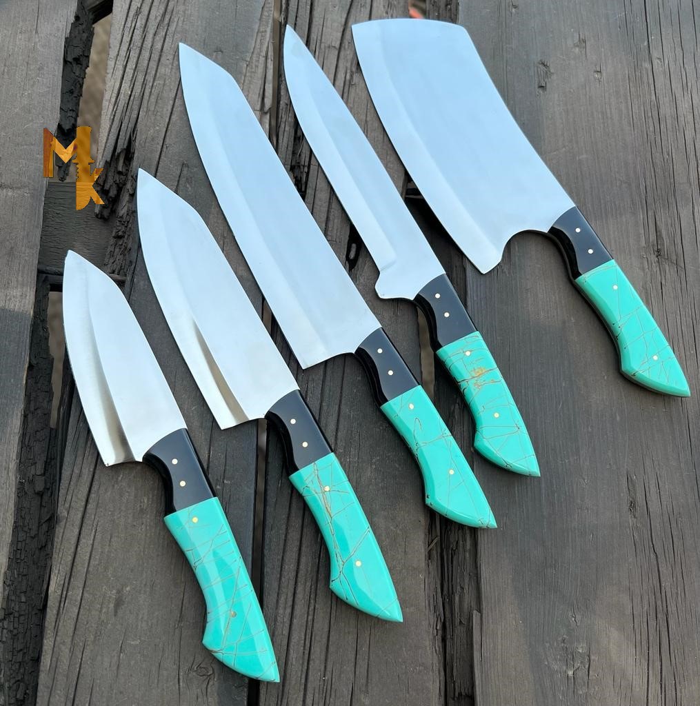 "An assortment of professional chef knives in a sleek knife block. The set includes a chef's knife, Santoku knife, utility knife, and paring knife. These high-quality knives feature sharp stainless steel blades and ergonomic handles for comfortable and precise cutting. A must-have for any kitchen, this chef knife set combines style and functionality to elevate your culinary experience."