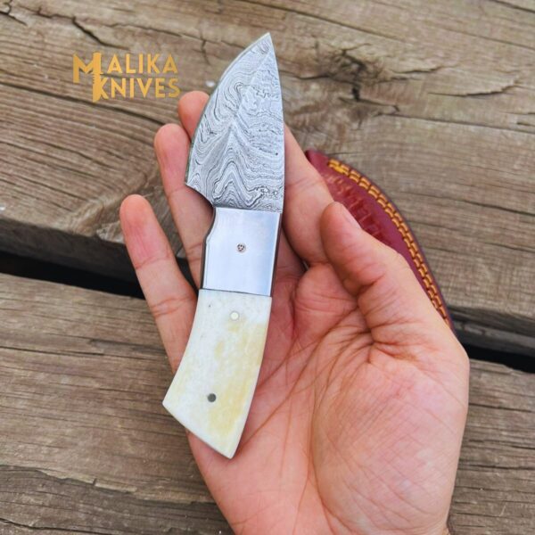 Camel-Bone EDC Skinner Knife features an elegant camel bone handle and a sharp stainless steel blade, designed for exceptional performance and portability.