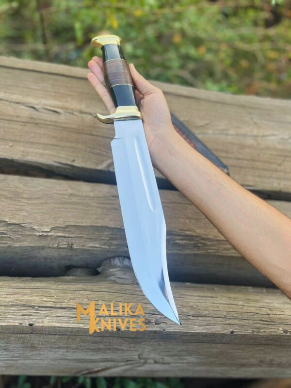 Crocodile Dundee Knife - A rugged and versatile knife with a stainless steel blade, ergonomic handle, and custom leather sheath. Perfect for outdoor adventures, survival situations, and everyday tasks.