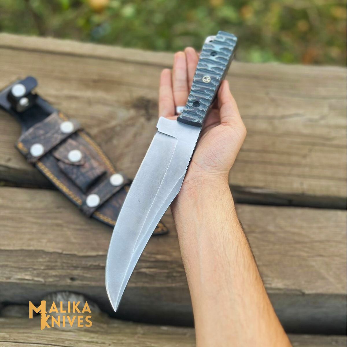 "Close-up of the Clip Point Bowie Knife with G10 Micarta handle, D2 steel blade, and Cowhide leather sheath, showcasing its exceptional craftsmanship and versatility."